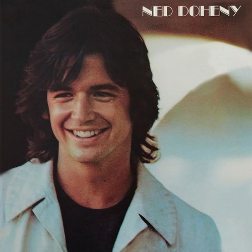 Vinyl record cover featuring Ned Doheny smiling, with his name in white text above.