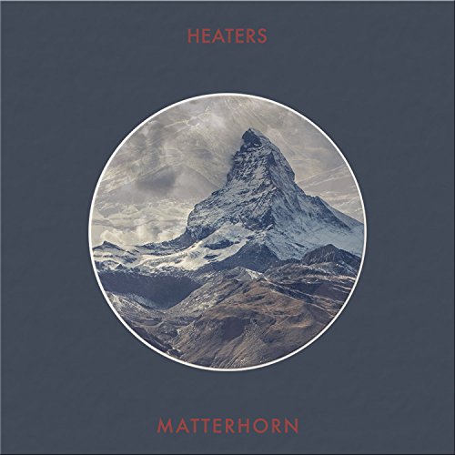 "Album cover with a circular image of a snowy mountain peak on a dark background."