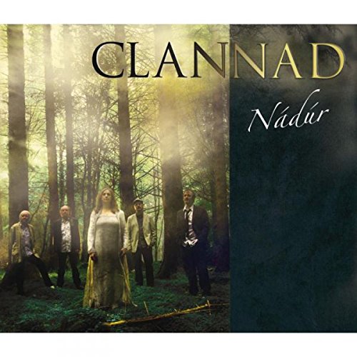 Clannad album cover: five people standing in a misty forest, formal attire.