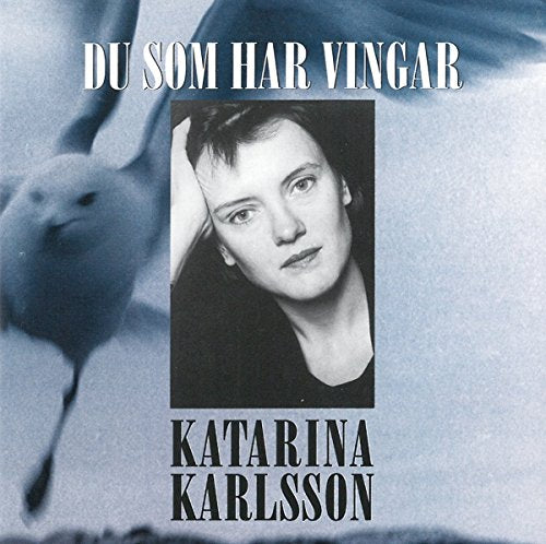 "CD cover with a black-and-white portrait and a blurred dove in the background."