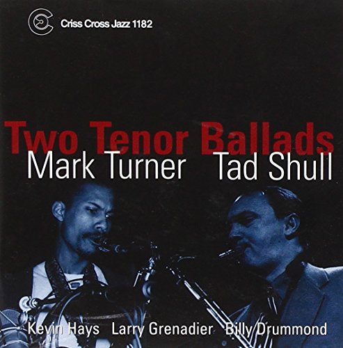Jazz album cover with two men singing into microphones, against a dark background.
