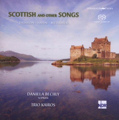 "CD cover featuring a serene lake with a castle, under a cloudy sky."