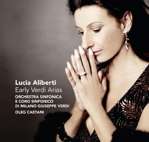 "CD cover featuring a woman in a dark dress with hands clasped together."