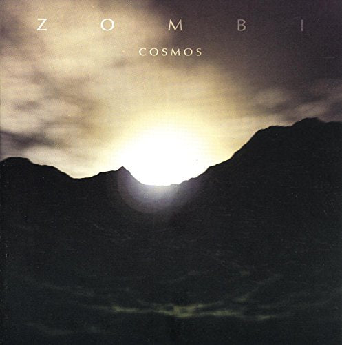 "Album cover with dark mountains and cloudy sky, sun shining through, titled 'Zombi - Cosmos'."