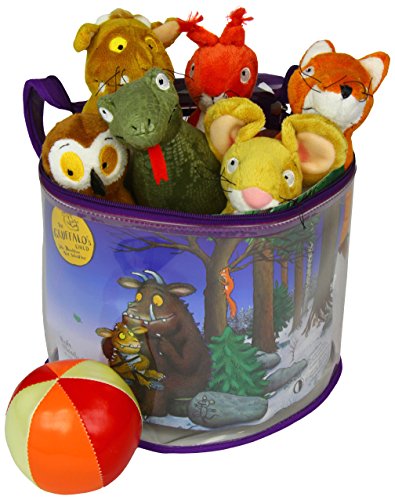 A purple storage bag filled with soft toys and a red and orange ball.