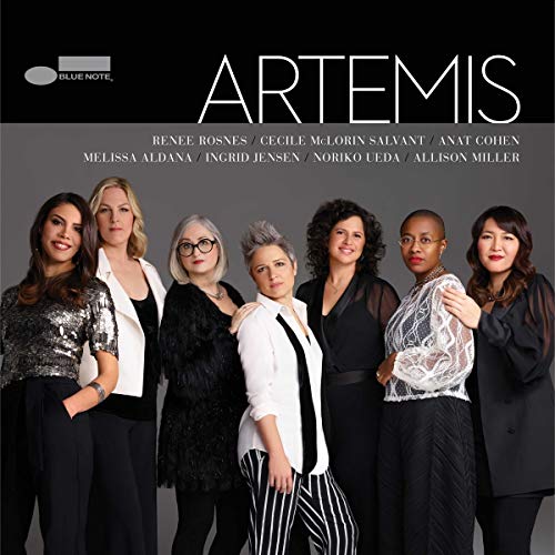 "Album cover featuring seven women in black and white outfits against a gray background."