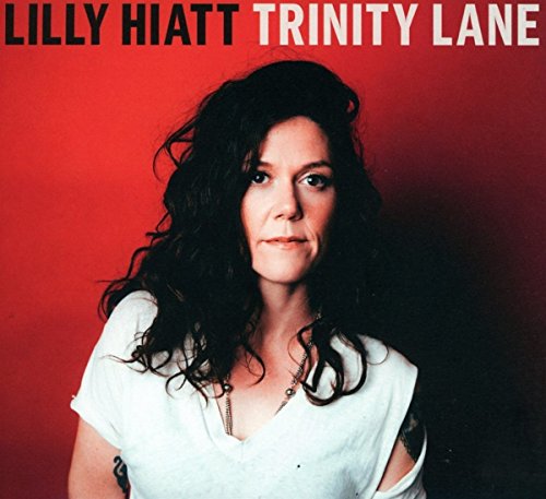 Woman with dark hair and tattoos on red gradient background, album cover for Lilly Hiatt.