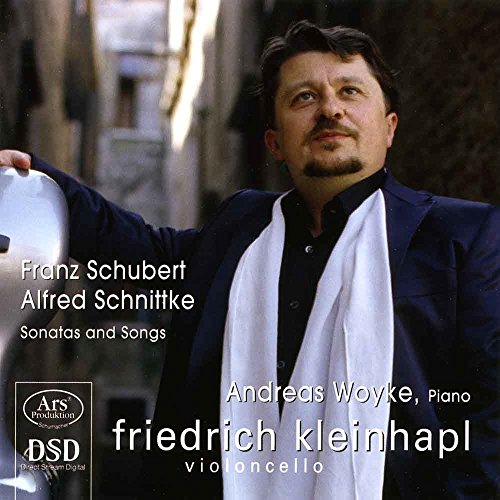 Man in dark jacket and white scarf holding a cello, outdoors, on a CD cover.