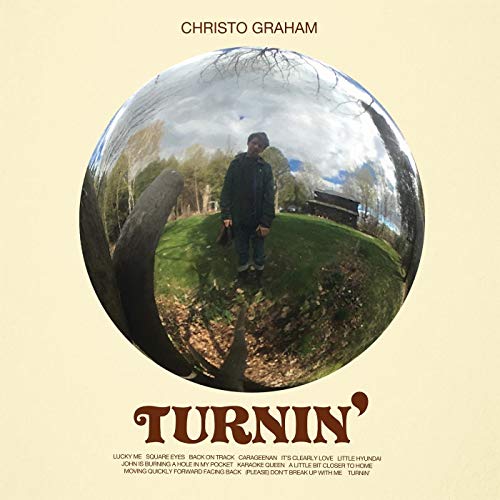 Album cover with a man in a reflective sphere, on a beige background.