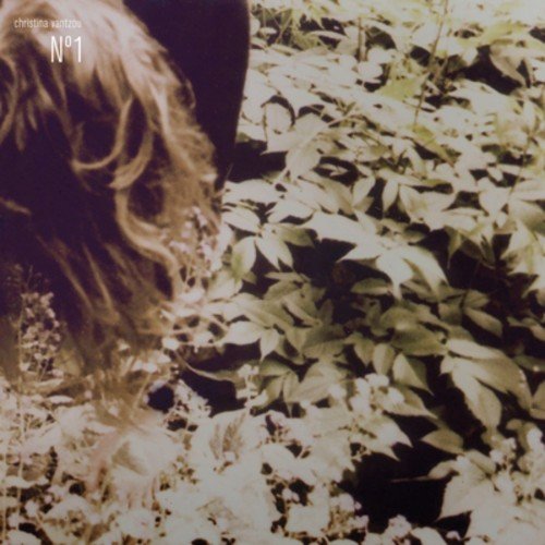 A woman's long hair amidst green leaves, album cover art for Christina Vantzou's No 1.