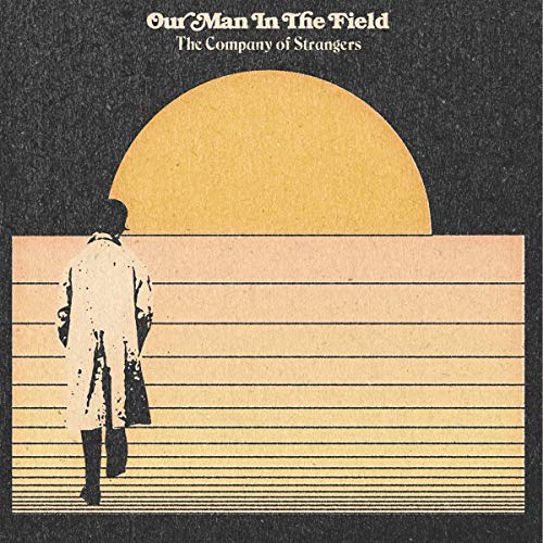"Album cover featuring a man in a coat walking away from a large sun."