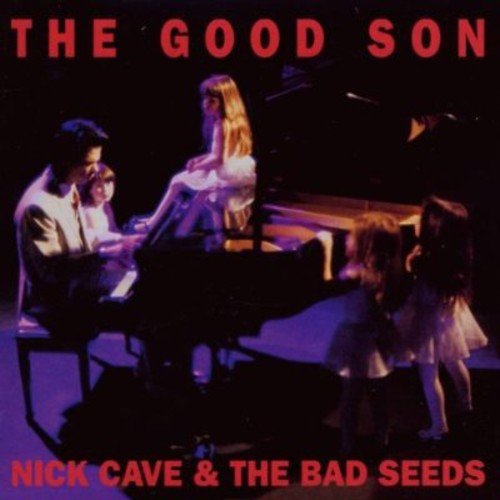 "Album cover featuring a man playing piano surrounded by three young girls."