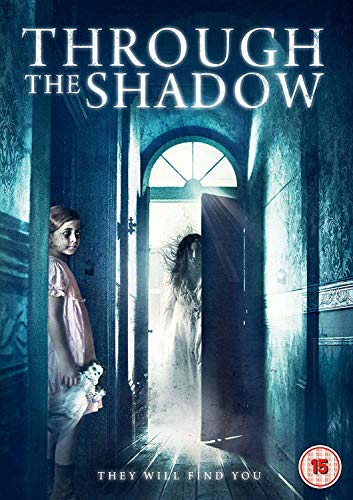 DVD cover: girl in doorway, ghostly figure in background, with title "Through The Shadow".