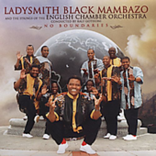 "Men in patterned shirts and black pants posing in front of a globe."