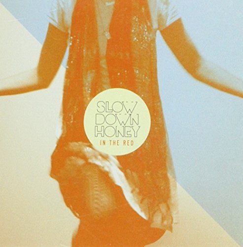 Album cover for "Slow Down Honey - In The Red" featuring a woman in a dress.