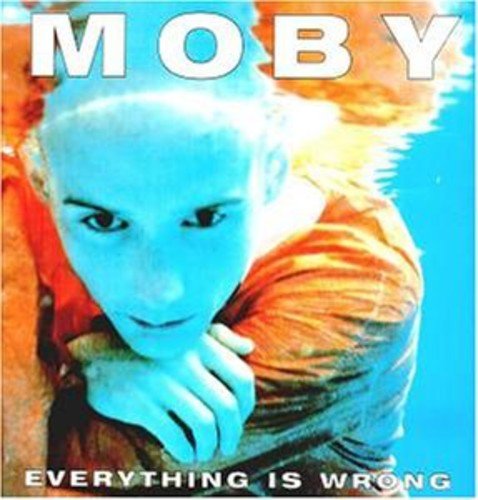 Moby album cover featuring a person underwater with blue skin and orange shirt.