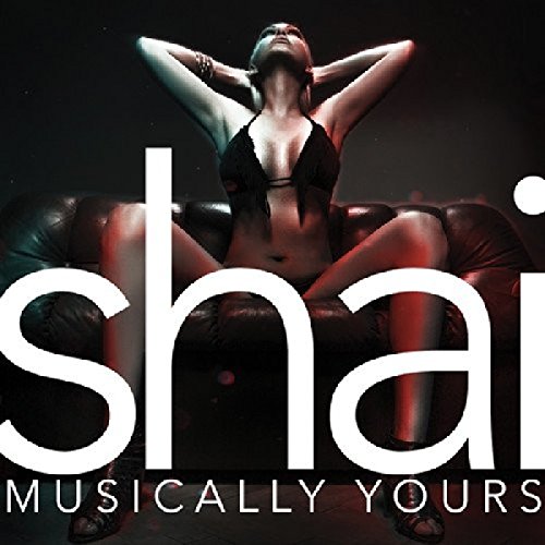 Album cover with a woman sitting on a couch, partially obscured by large white text.