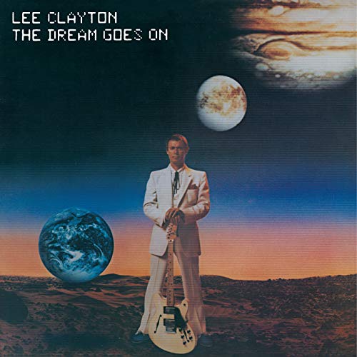 "Album cover with man in white suit holding guitar, surrounded by planets."