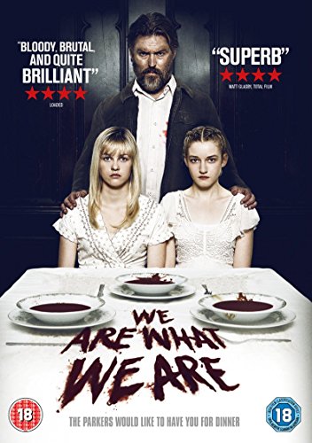 DVD cover featuring a man and two girls at a table with bloody soup.