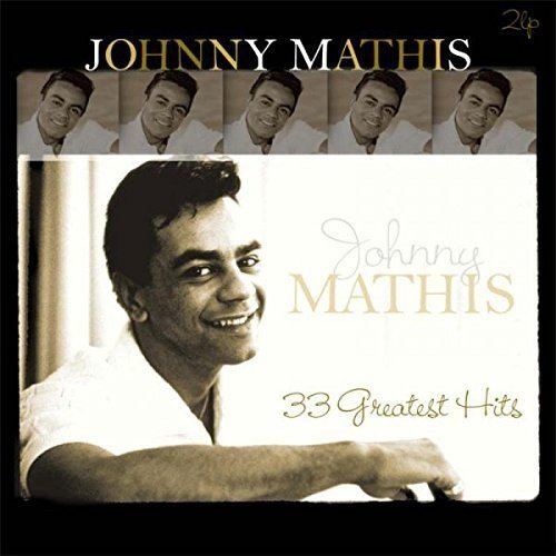 "Vinyl album cover with Johnny Mathis portrait and multiple smaller images, black background."