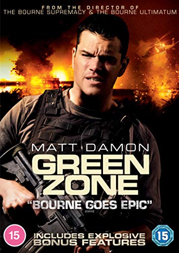 "Matt Damon in tactical gear holding a gun, with a burning cityscape behind him."