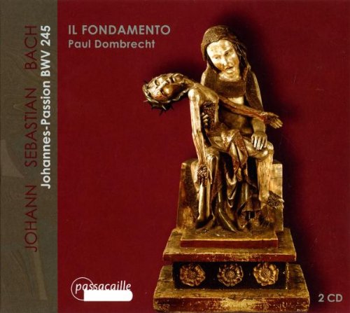 CD cover with a gold statue of a seated figure holding a head.