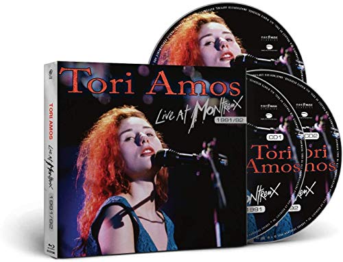 CD case and two discs with Tori Amos singing into a microphone.