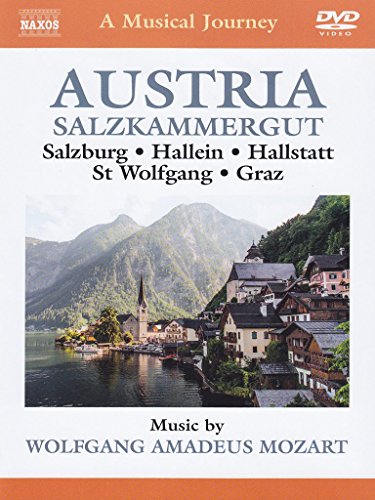 DVD cover featuring a village by a lake with mountains in the background.