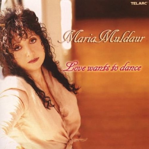 "Album cover featuring Maria Muldaur, a woman with curly hair, in a white shirt."