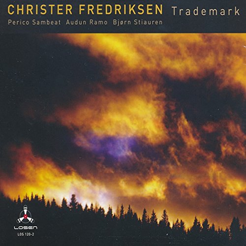 "Album cover with a forest silhouette under a dark, cloudy sky at sunset."