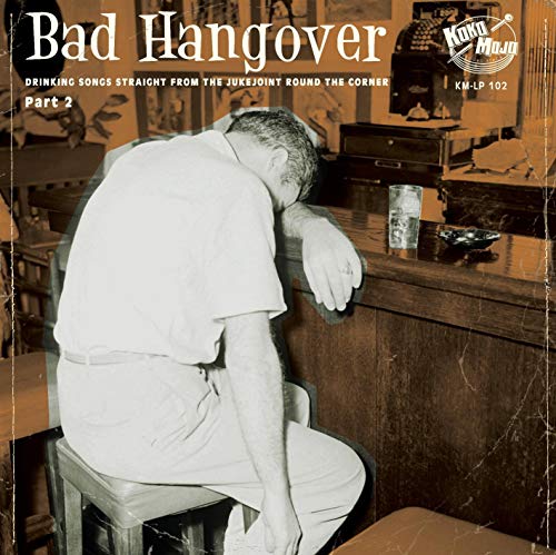 "Vinyl record cover showing a man slumped over a bar with a drink nearby."