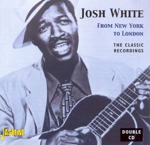 "CD cover with black-and-white image of man playing guitar and smiling."