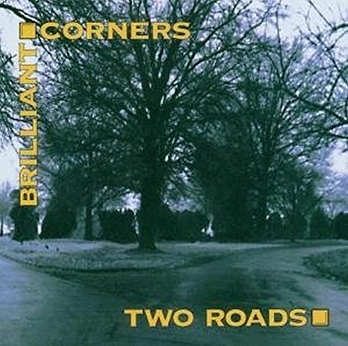 Album cover with a road diverging into two paths, surrounded by bare trees.