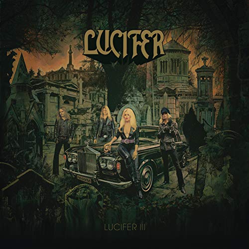 "Album cover art featuring a band standing around a vintage car in a graveyard."