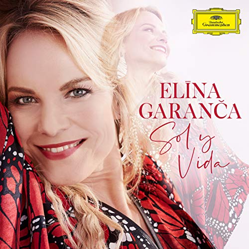 "CD cover featuring a smiling blonde woman in a red patterned shawl."