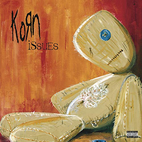 Korn’s “Issues” album cover: a painted, stitched doll against orange.
