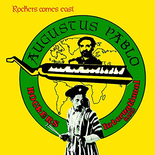 "Yellow album cover with green circle, featuring keyboard and two men's images."