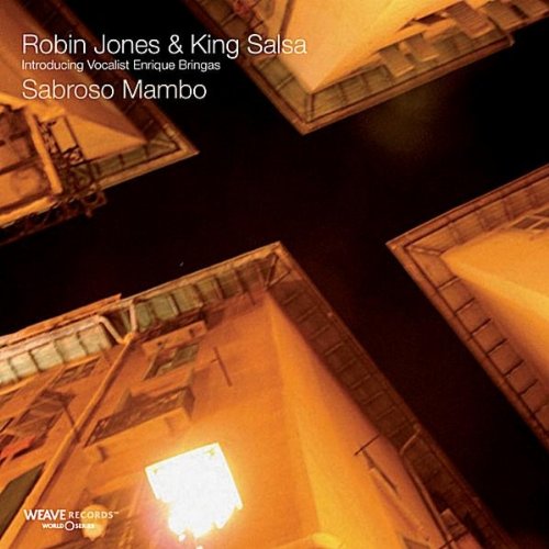 "CD cover with orange-lit rooftops against a dark background, displaying album title and artist."