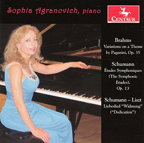 CD cover featuring a woman in a blue dress sitting at a piano.