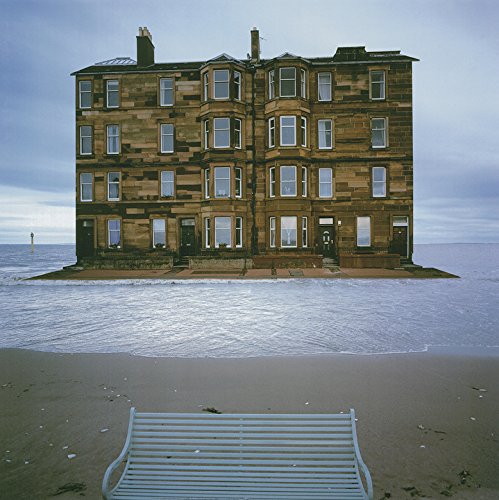 A CD case with a surreal image of a building on the water.