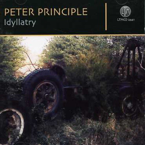 Album cover with abandoned vehicle in overgrown field, dark green header, and artist's name.