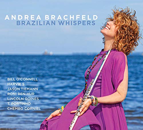 "CD cover featuring a woman in purple holding a flute by the ocean."