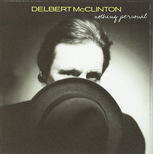 "Album cover featuring a black and white photo of a man holding a hat."