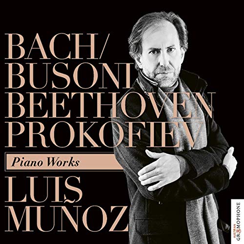 CD cover with a man in a coat and beige text on a black background.