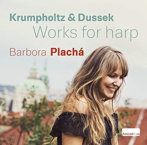 A CD cover featuring a smiling woman with a cityscape behind her.