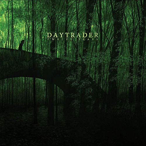 The vinyl record cover features a person on a bridge in a dark forest.