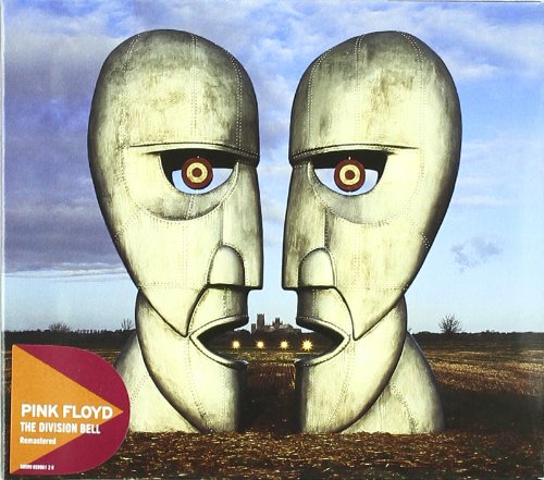 "Two large stone heads facing each other with glowing eyes in a field."