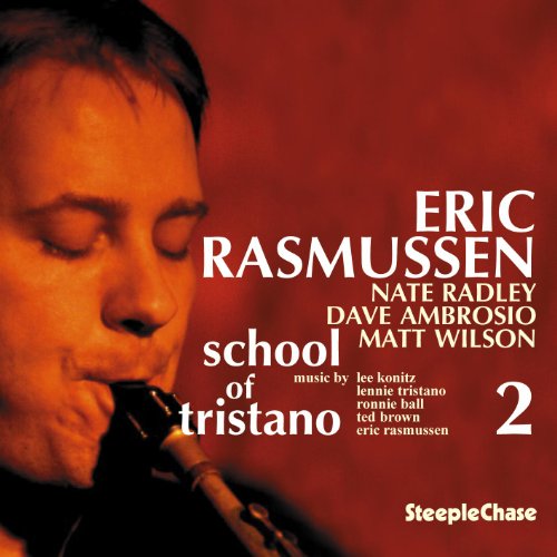 "Album cover featuring a man playing saxophone, with red background and white text."