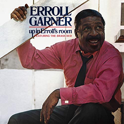 "Album cover featuring Erroll Garner sitting on stairs, wearing a red shirt."
