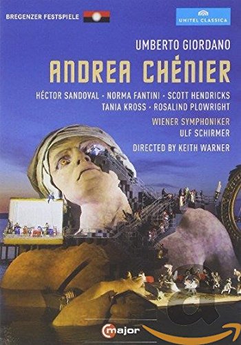 DVD cover for "Andrea Chenier" featuring a stage scene with a giant head and performers.